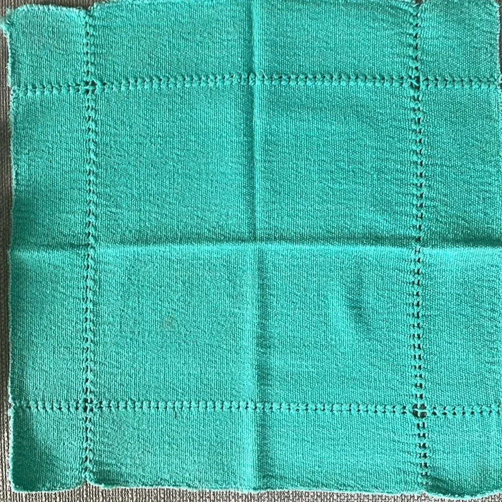 A set of four -3” square cotton napkins. Very soft.